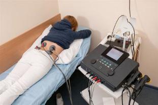 Electrophoresis is assigned to patients for the treatment of back pain and relief from inflammation
